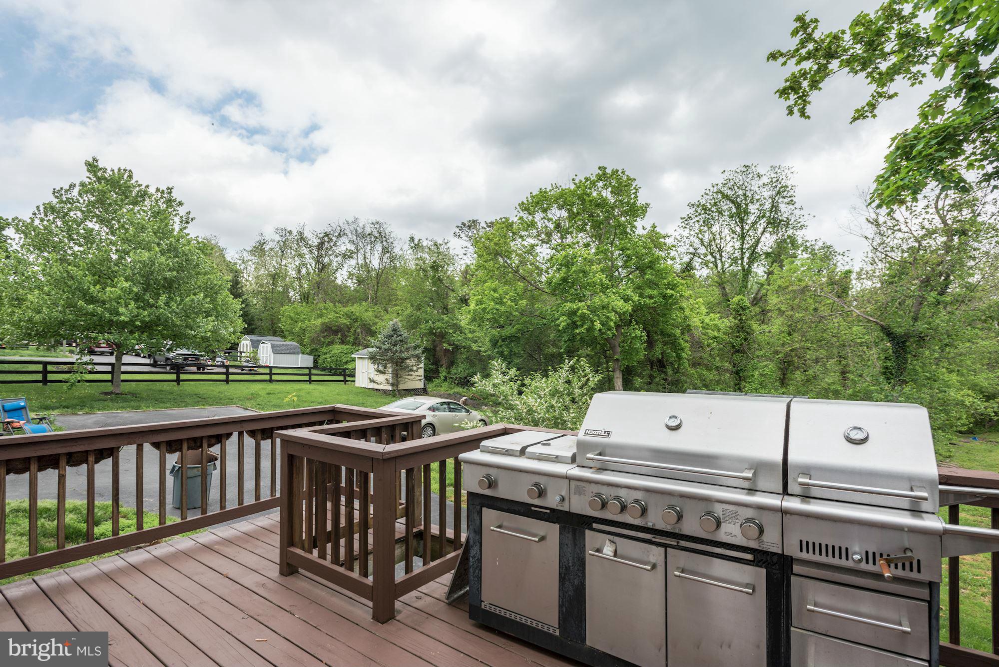 17 New Cut Road Round Hill, VA 20141 - Photo 24 of 29 a view of a chairs and table on the wooden deck