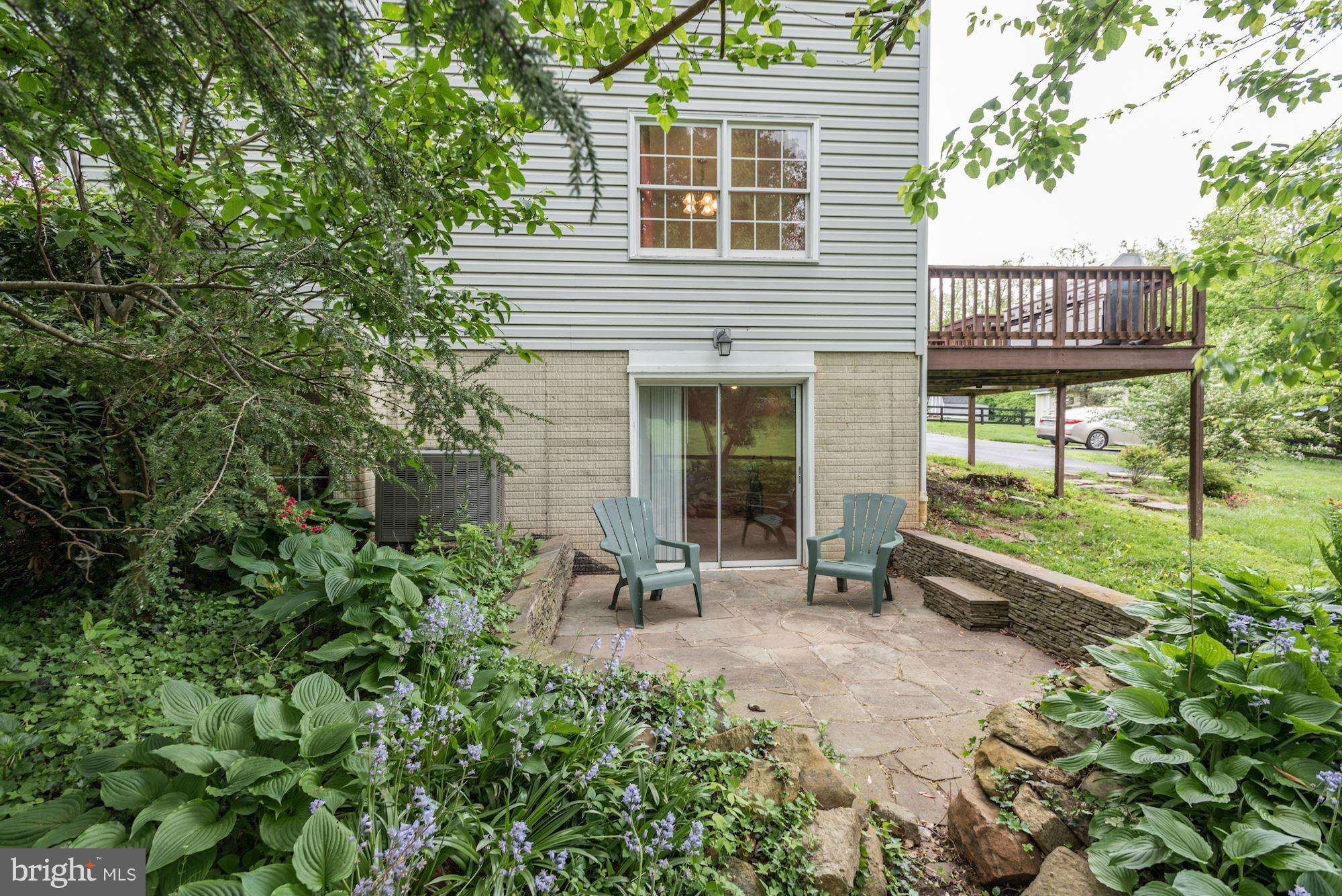 17 New Cut Road Round Hill, VA 20141 - Photo 28 of 29 a view of a house with backyard sitting area and garden