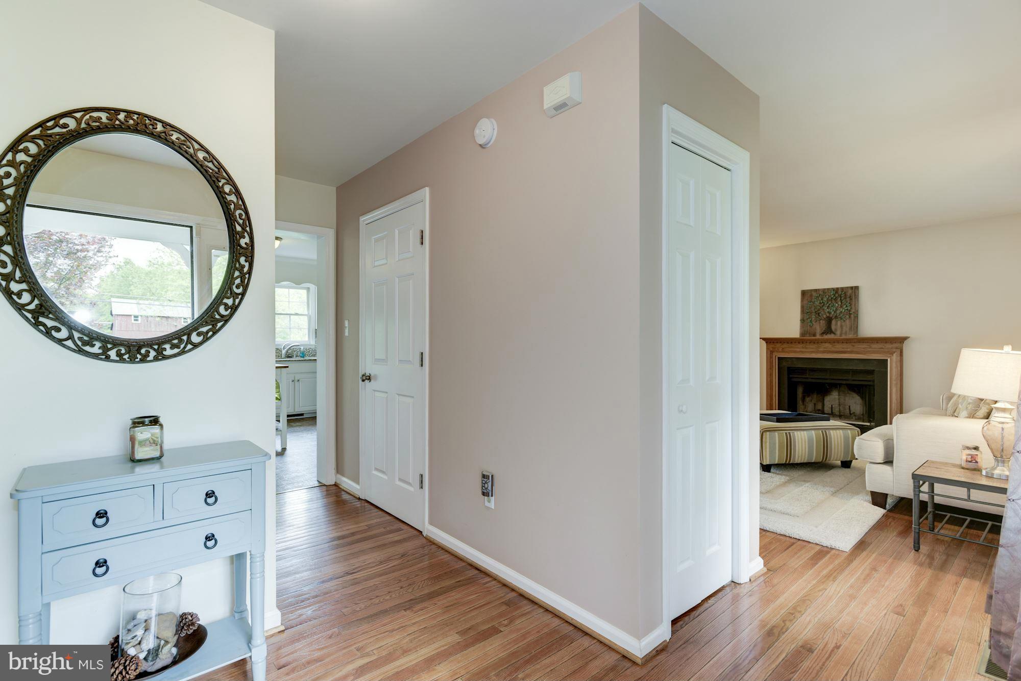 17 New Cut Road Round Hill, VA 20141 - Photo 5 of 29 a living room with furniture and a wooden floor