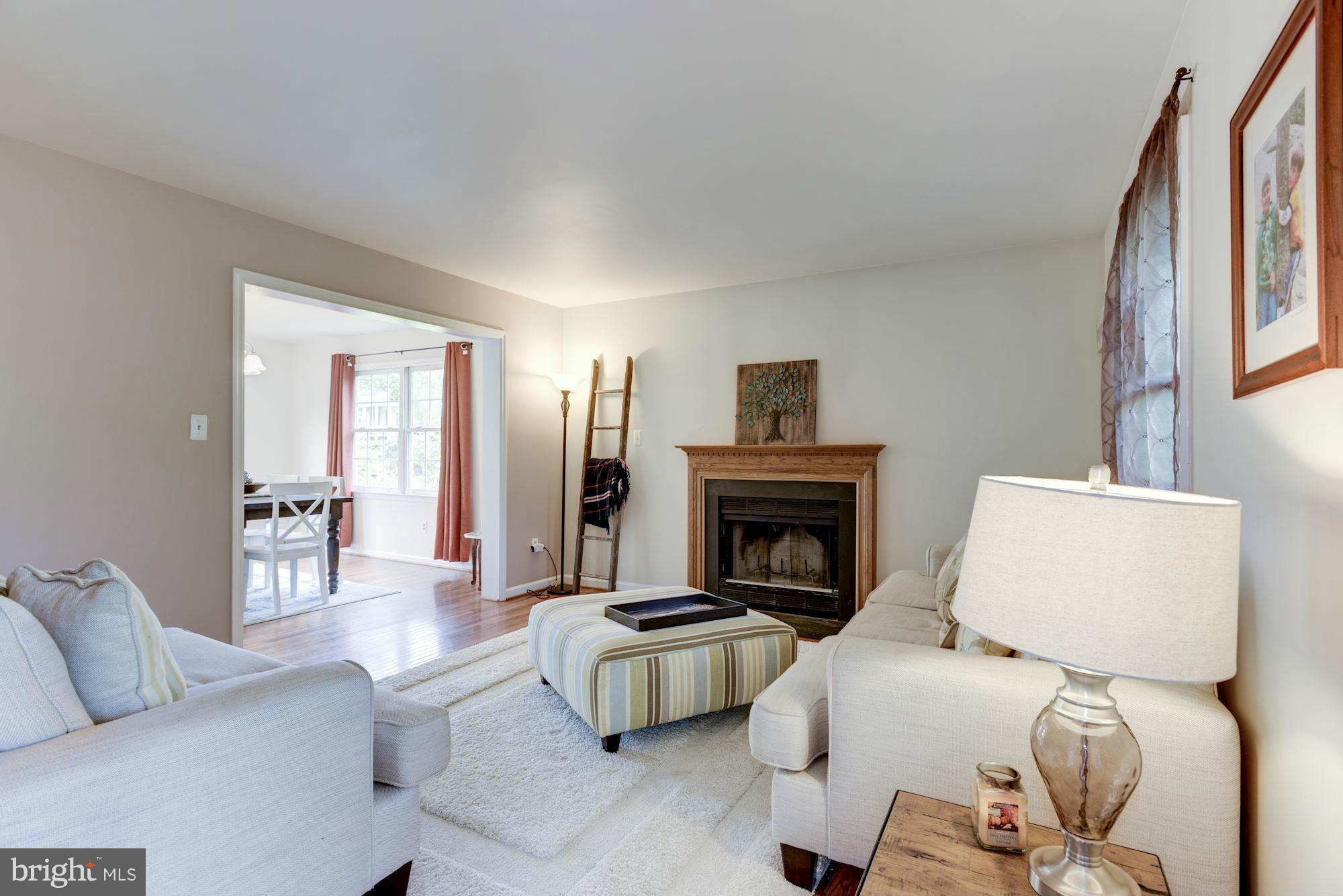 17 New Cut Road Round Hill, VA 20141 - Photo 6 of 29 a living room with furniture and a fireplace
