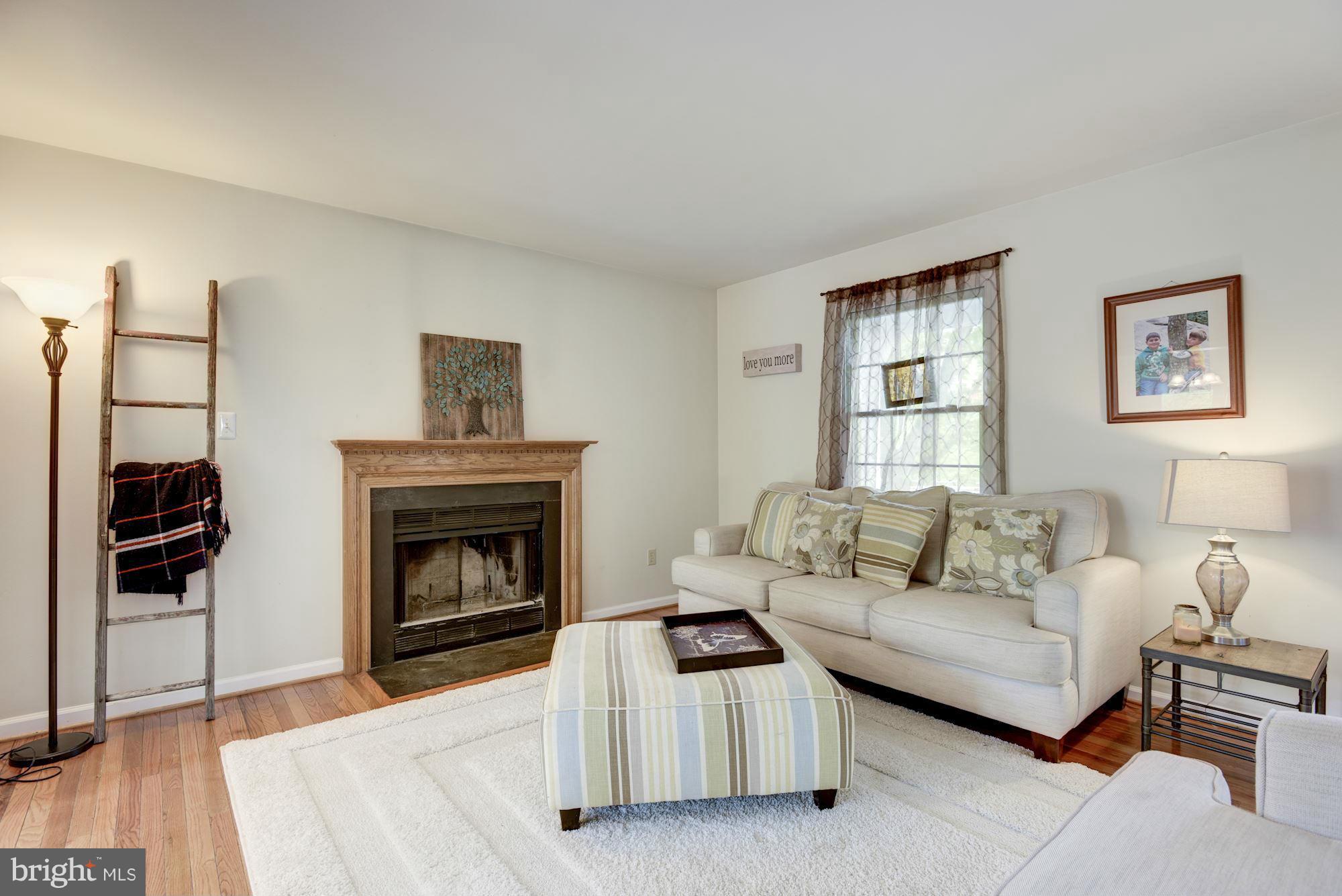 17 New Cut Road Round Hill, VA 20141 - Photo 7 of 29 a living room with furniture a window and a fireplace