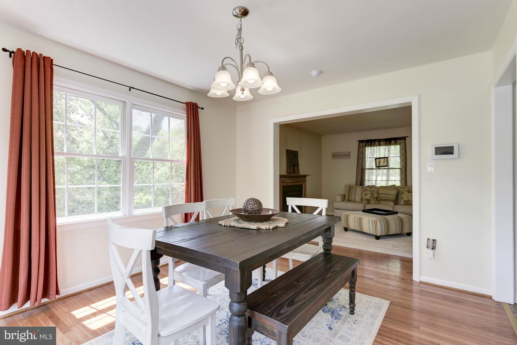 17 New Cut Road Round Hill, VA 20141 - Photo 9 of 29 a view of a dining room with furniture wooden floor and a chandelier