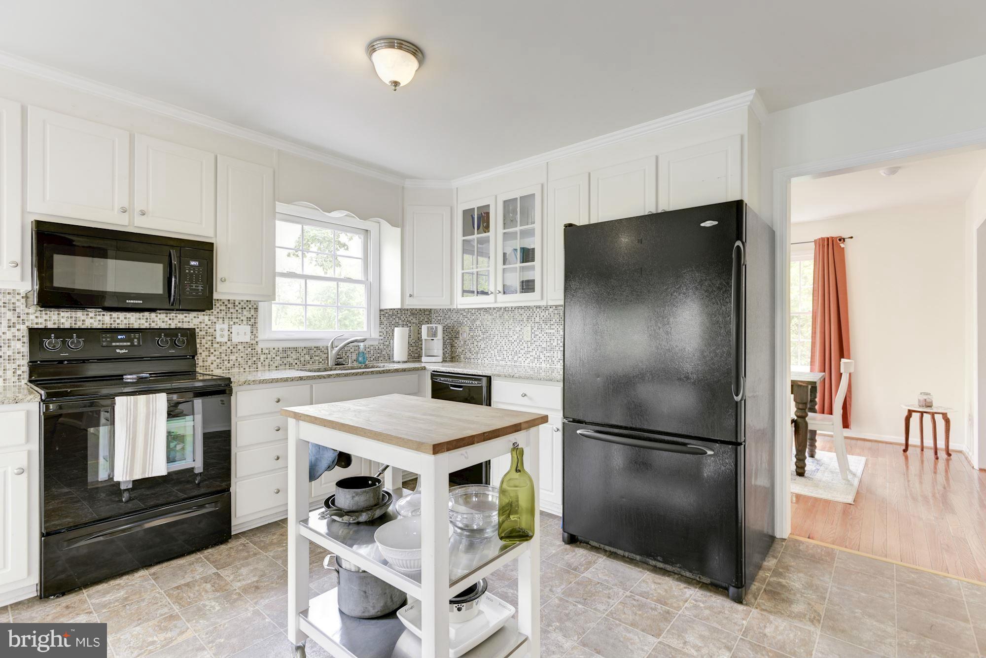 17 New Cut Road Round Hill, VA 20141 - Photo 10 of 29 a kitchen with a refrigerator stove and microwave