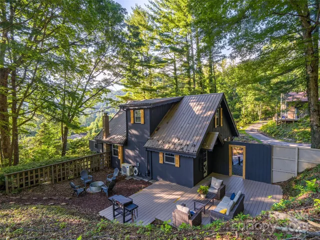 a view of a house with a yard porch and sitting area
