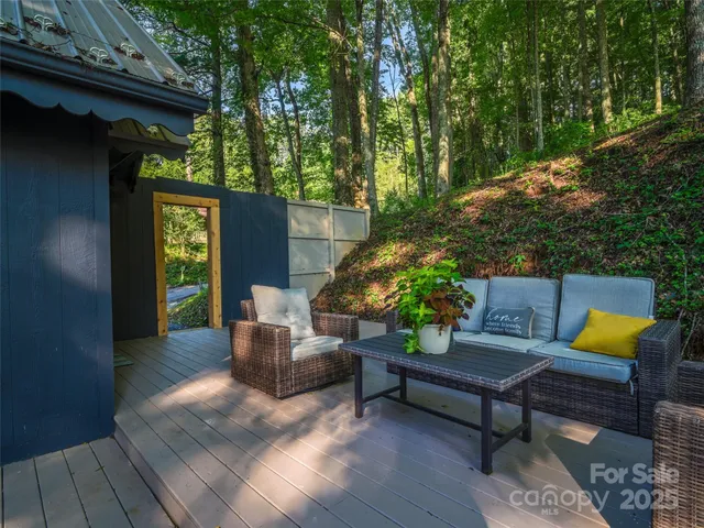 a outdoor living space with furniture and a potted plant