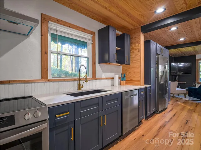 a kitchen with a sink and wooden cabinets
