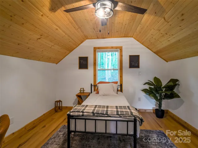 a dining room with furniture and a potted plant