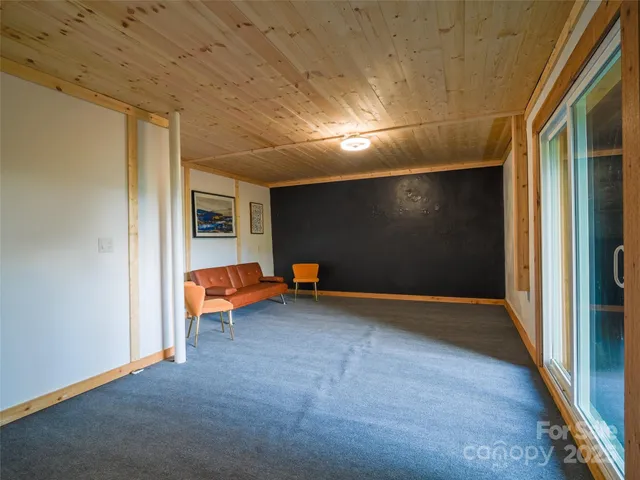 a view of game room with windows