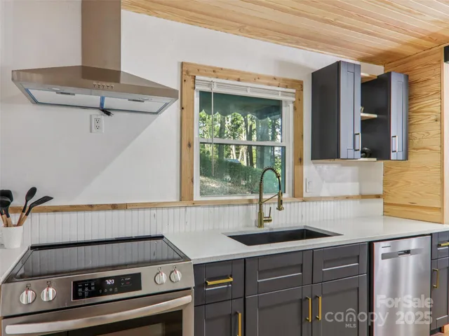 a kitchen with a sink and a window
