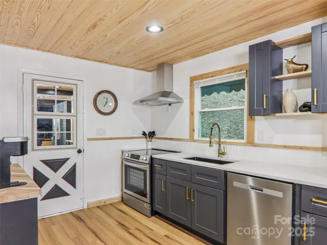 a kitchen with a sink and a stove