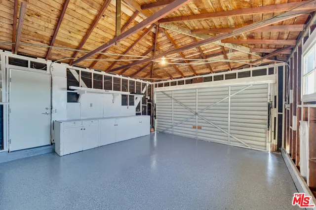 a view of storage and utility room with stairs