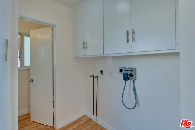 a bathroom with a sink mirror and window