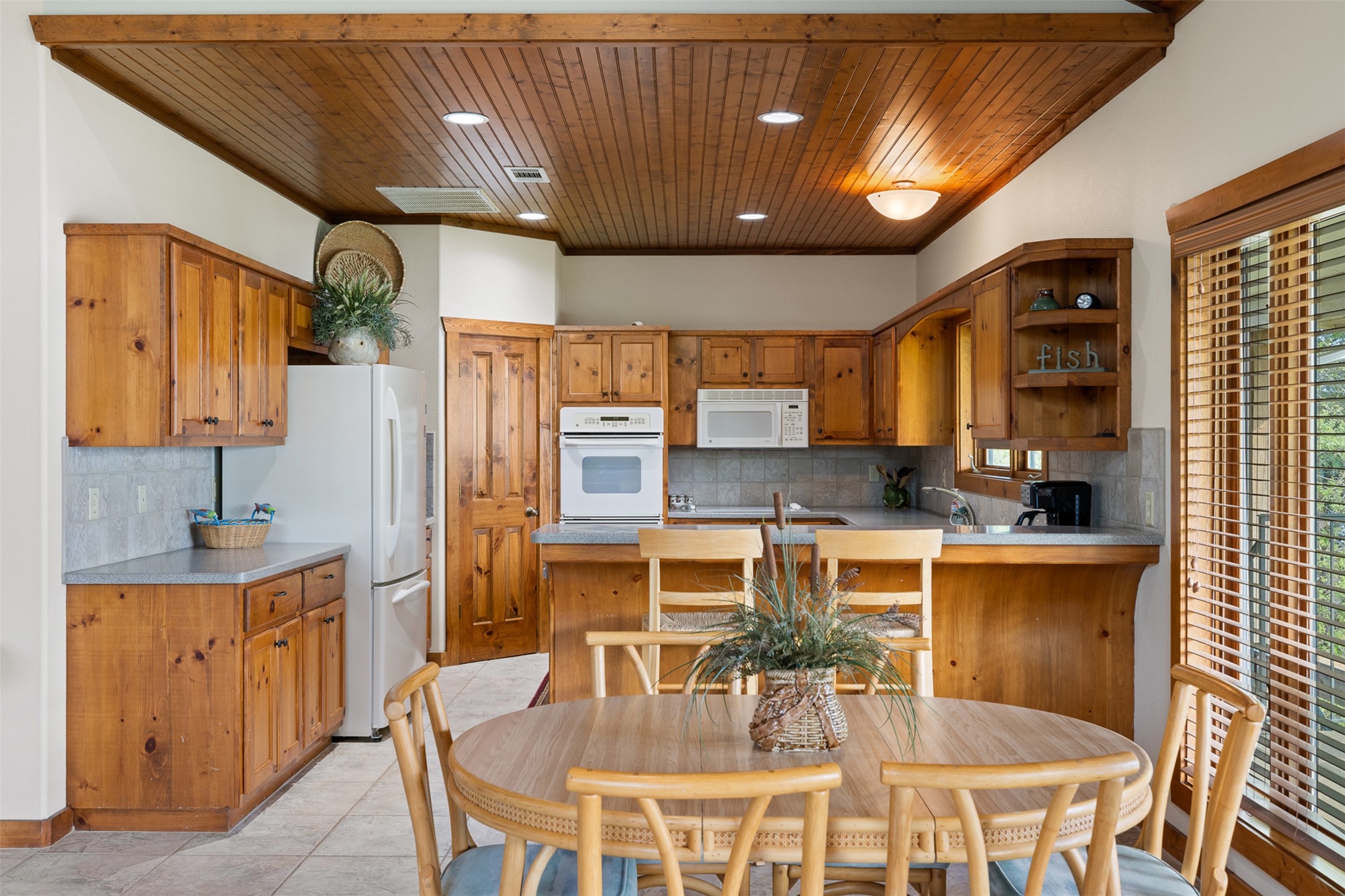 10959 Clyde Acord Road Franklin, TX 77856 - Photo 16 of 39 a kitchen with a table and chairs