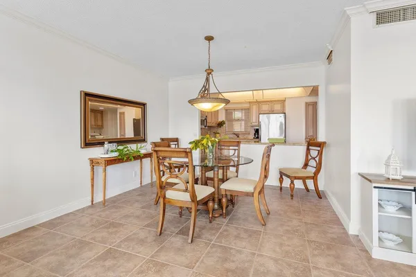 a large kitchen with kitchen island a sink stainless steel appliances and cabinets
