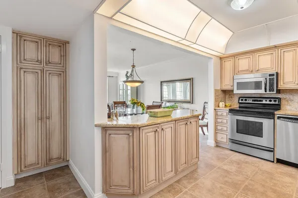 a bathroom with a sink a vanity and a window