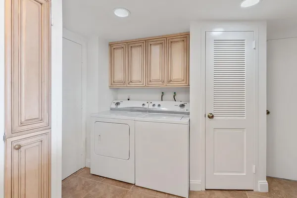 a kitchen with stainless steel appliances a refrigerator sink and microwave