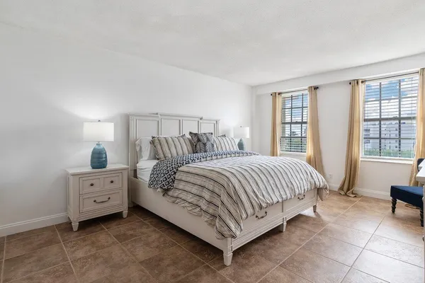 a bedroom with a bed and a cabinets