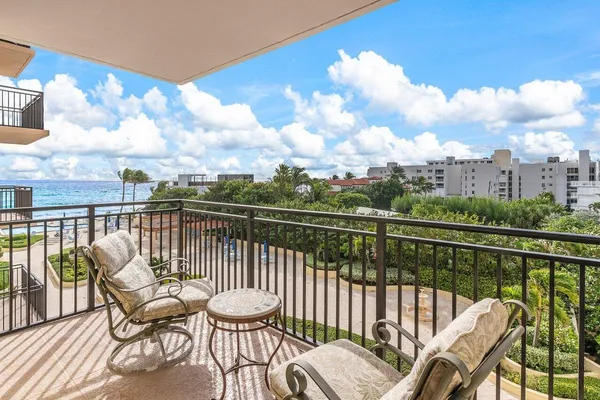 a view of a chair and table in the balcony