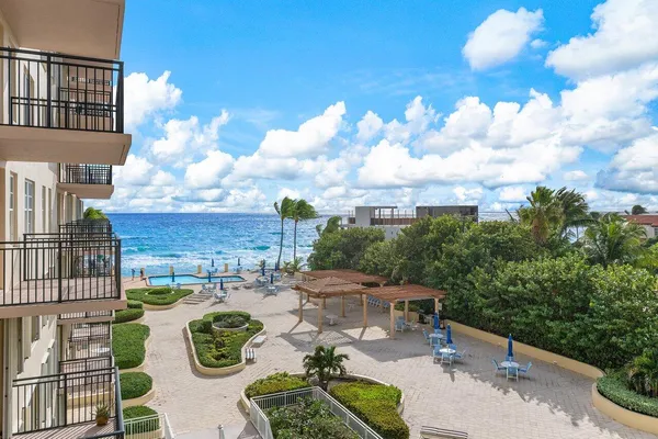 a view of a backyard with sitting area