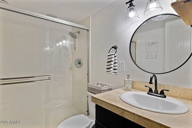 a view of a house with yard and a street