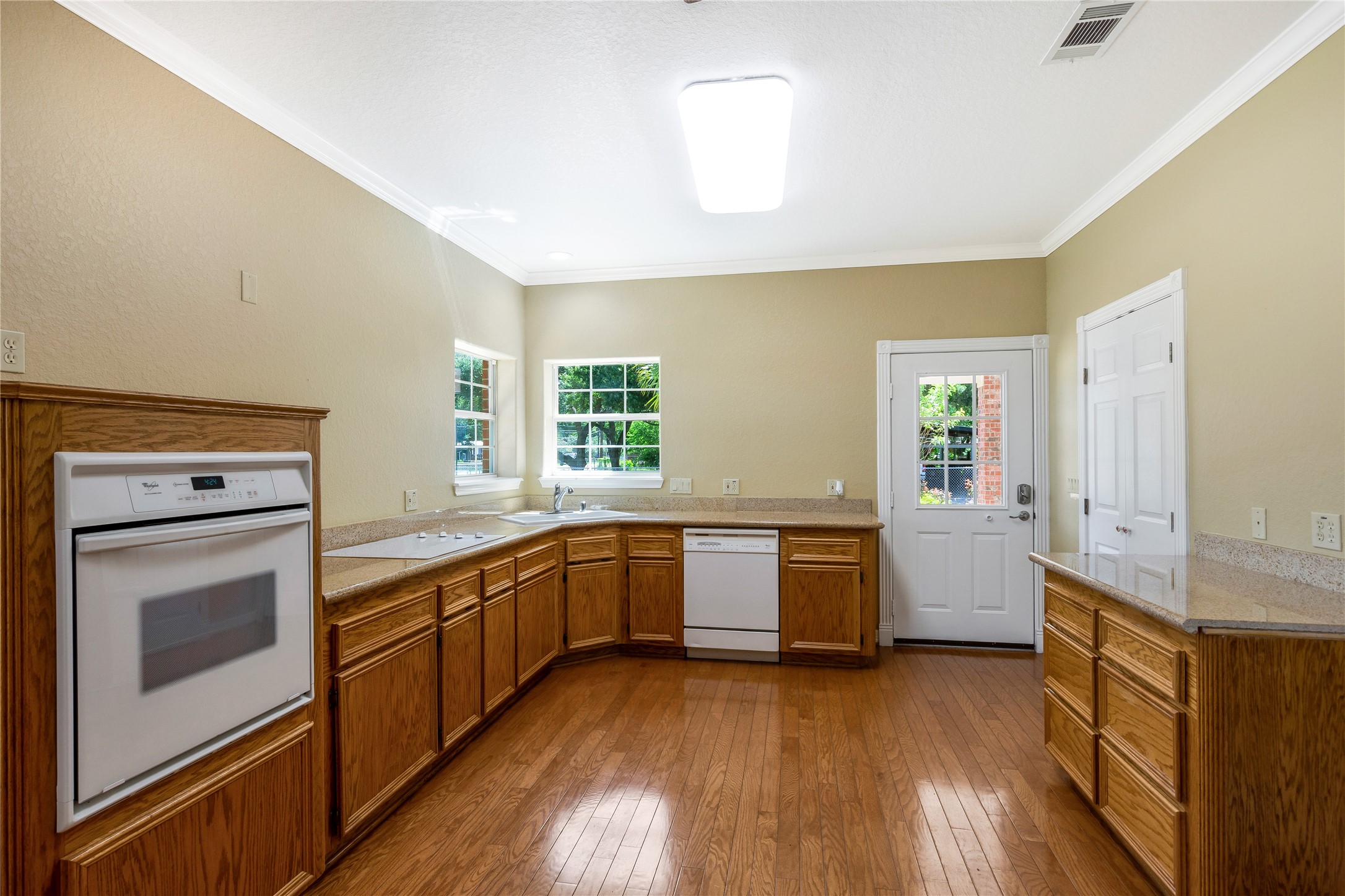1112 Crenshaw Road Pasadena, TX 77504 - Photo 10 of 50 KITCHEN CABINET AREA W/ GRANITE COUNTERTOPS & WOOD FLOORS!