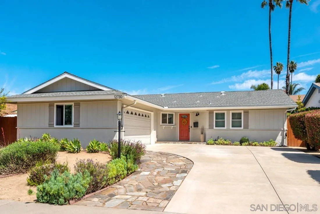 12730 Rios Road San Diego, CA 92128 - Photo 1 of 31 a front view of a house with a yard and potted plants