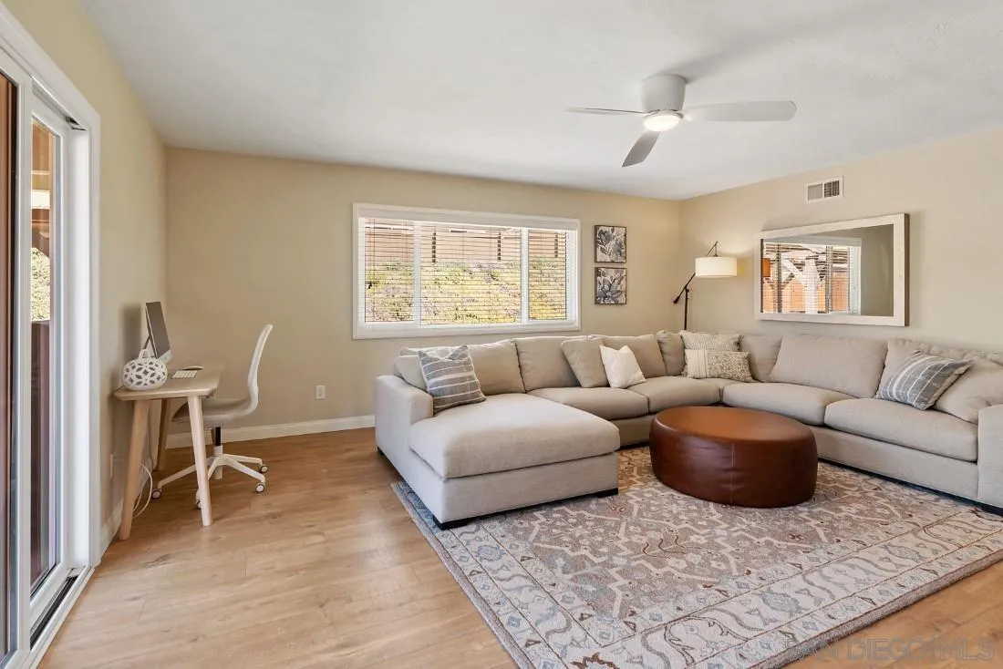 12730 Rios Road San Diego, CA 92128 - Photo 2 of 31 a living room with furniture and a window