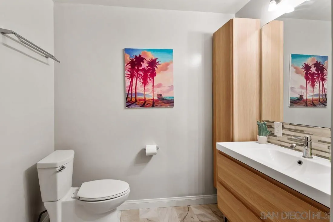 12730 Rios Road San Diego, CA 92128 - Photo 21 of 31 a bathroom with a sink vanity and toilet