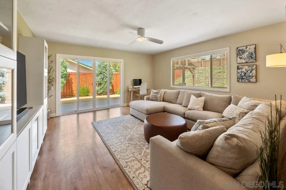 12730 Rios Road San Diego, CA 92128 - Photo 4 of 31 a living room with furniture and a large window