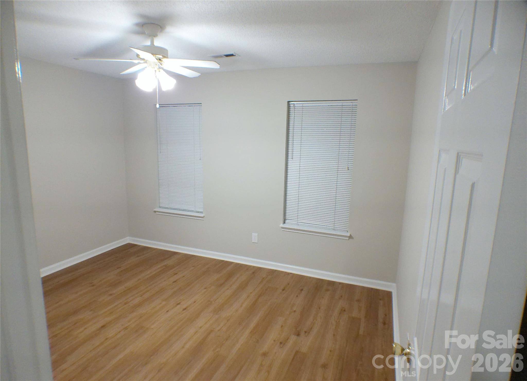 9112 4 Mile Creek Road Charlotte, NC 28277 - Photo 12 of 22 a view of an empty room with wooden floor