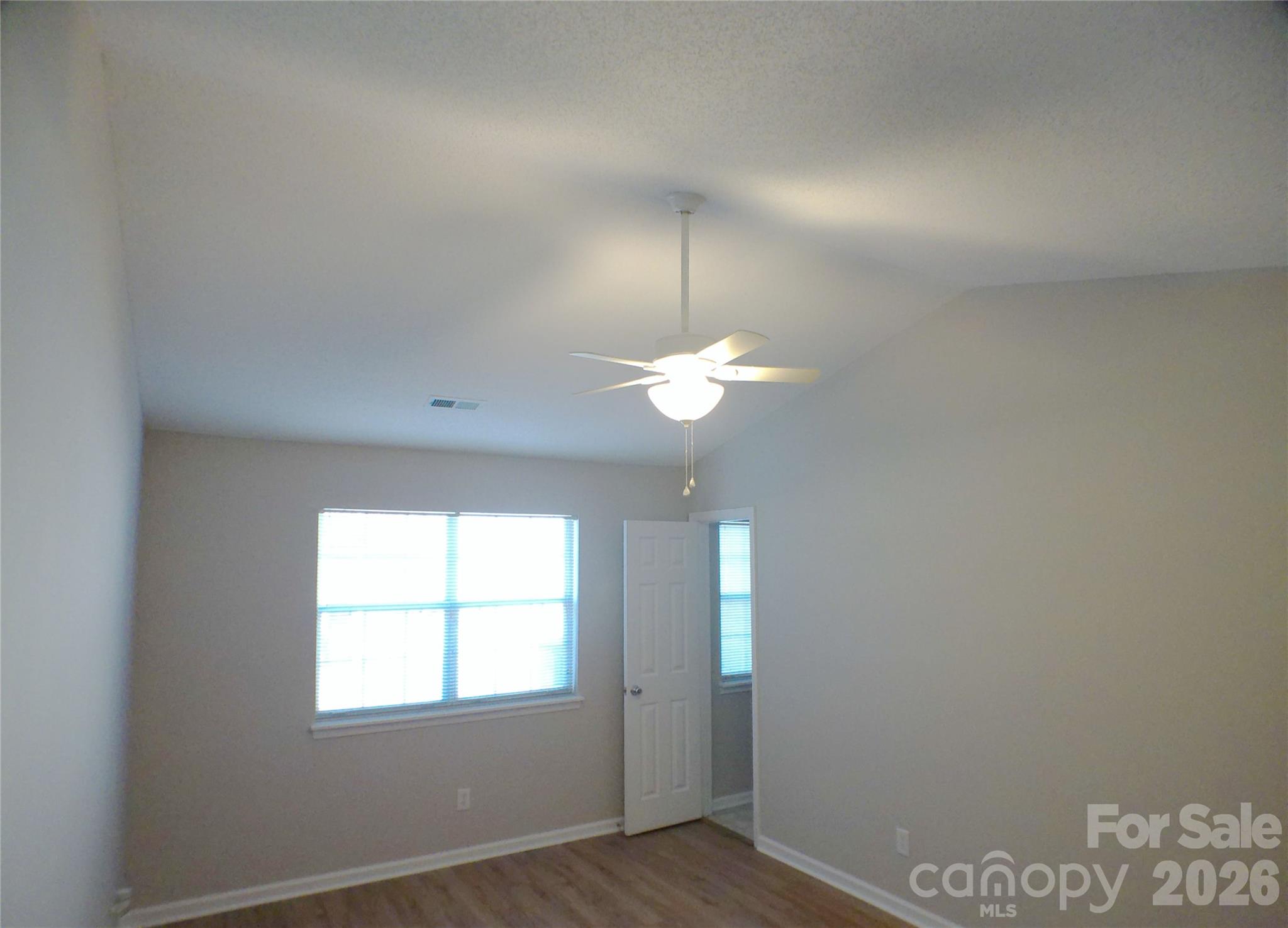 9112 4 Mile Creek Road Charlotte, NC 28277 - Photo 13 of 22 an empty room with chandelier fan and windows