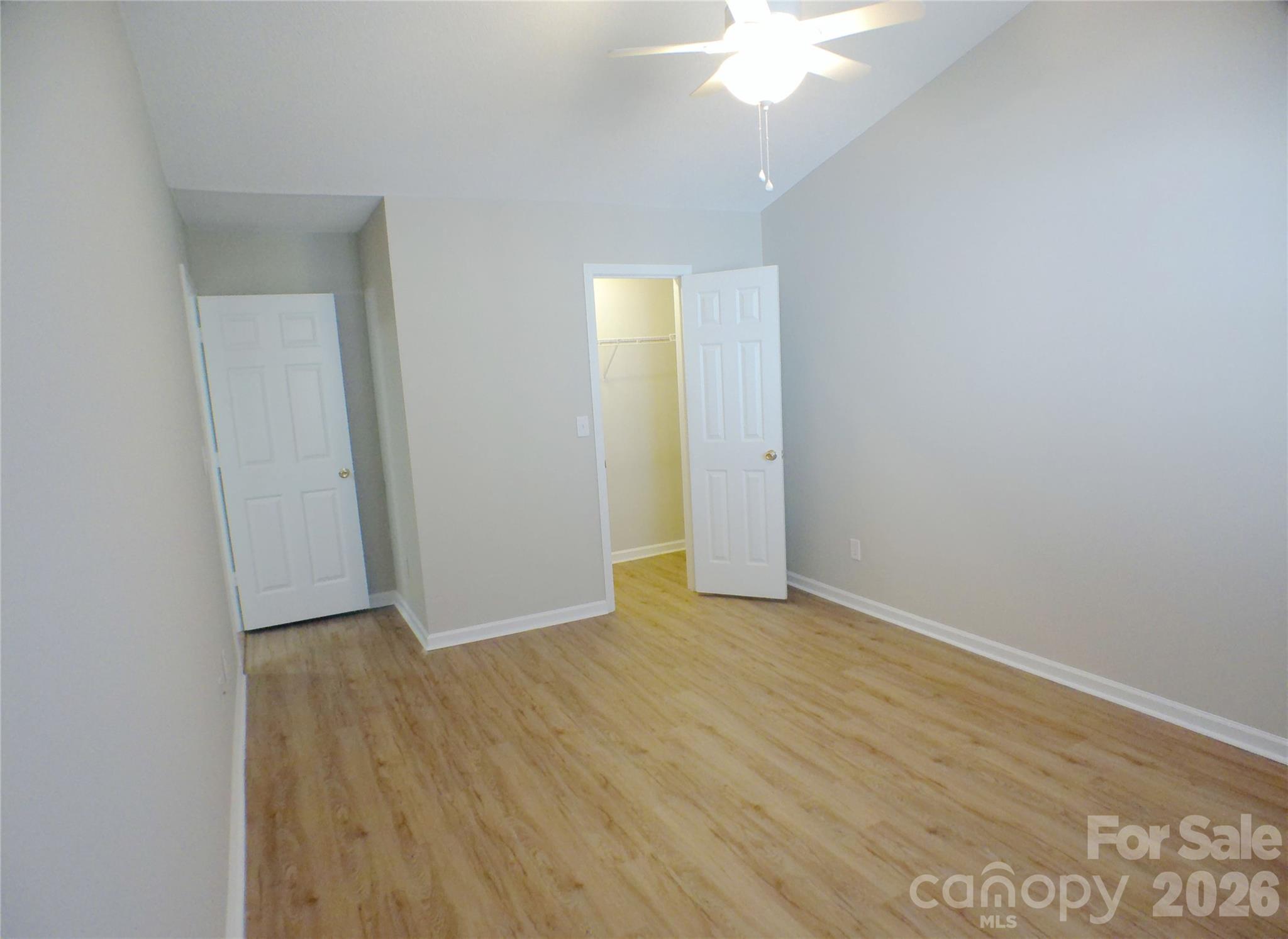 9112 4 Mile Creek Road Charlotte, NC 28277 - Photo 15 of 22 an empty room with wooden floor and windows