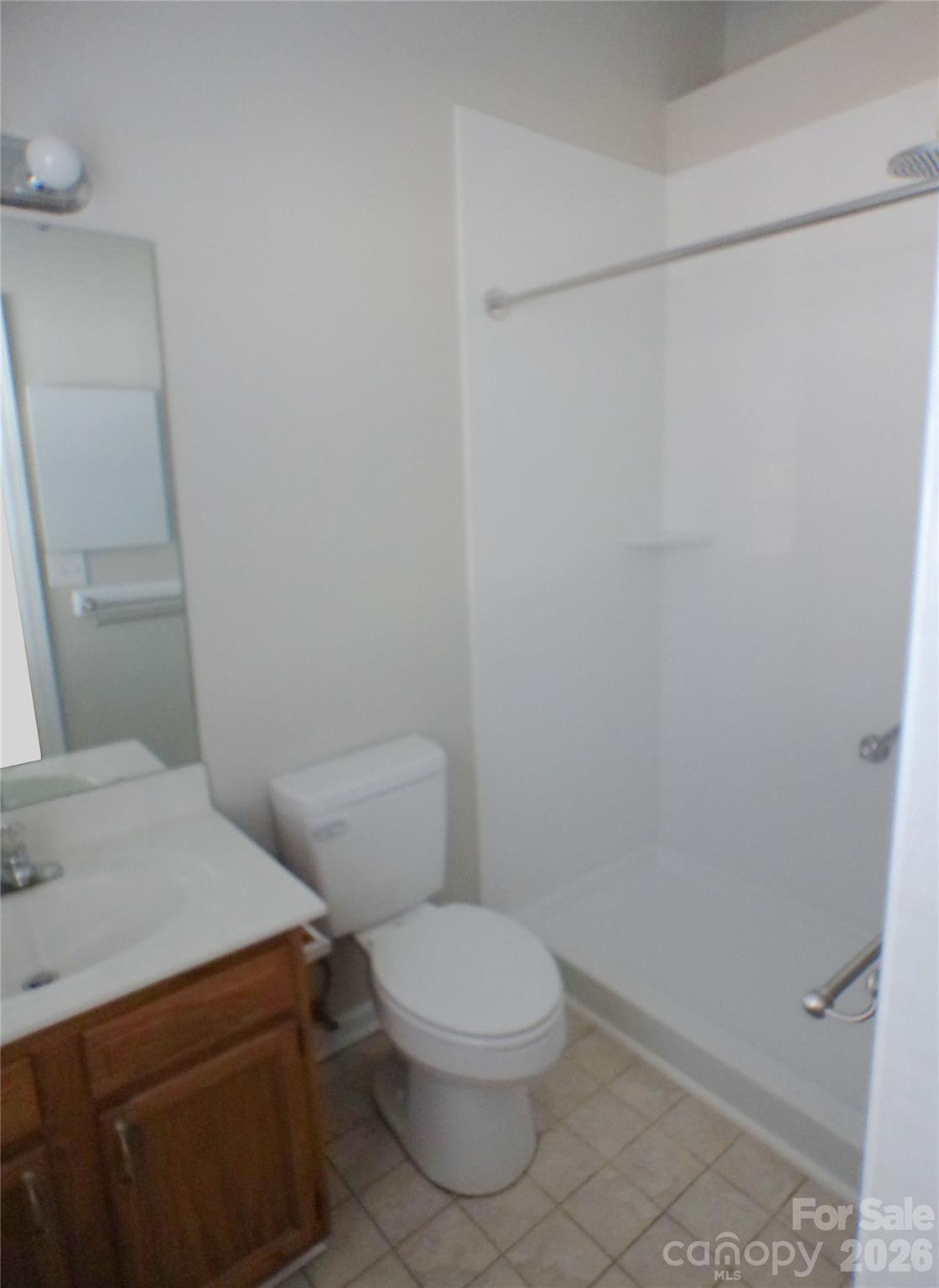 9112 4 Mile Creek Road Charlotte, NC 28277 - Photo 17 of 22 a white toilet sitting next to a shower