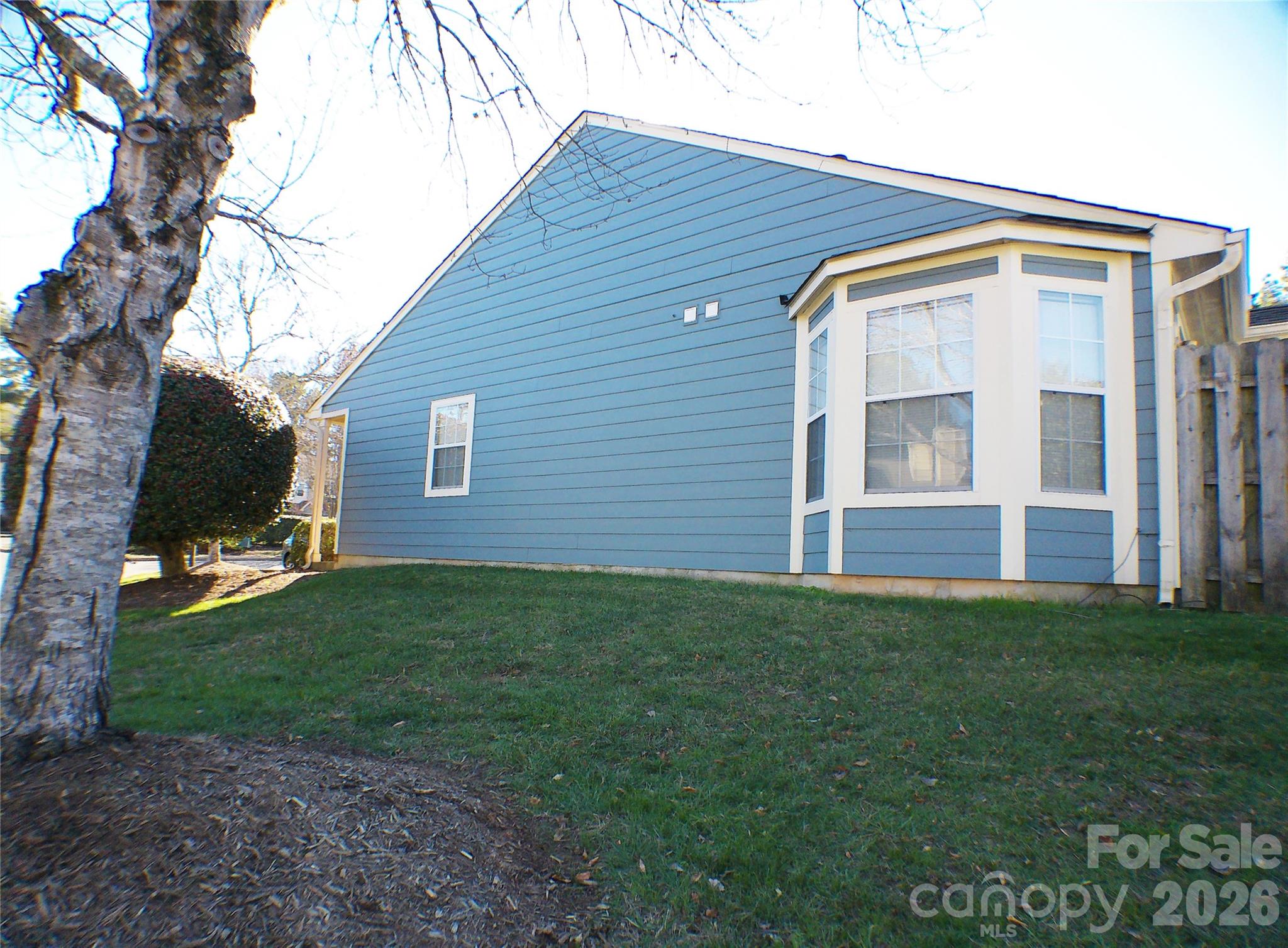 9112 4 Mile Creek Road Charlotte, NC 28277 - Photo 19 of 22 a front view of a house with a yard