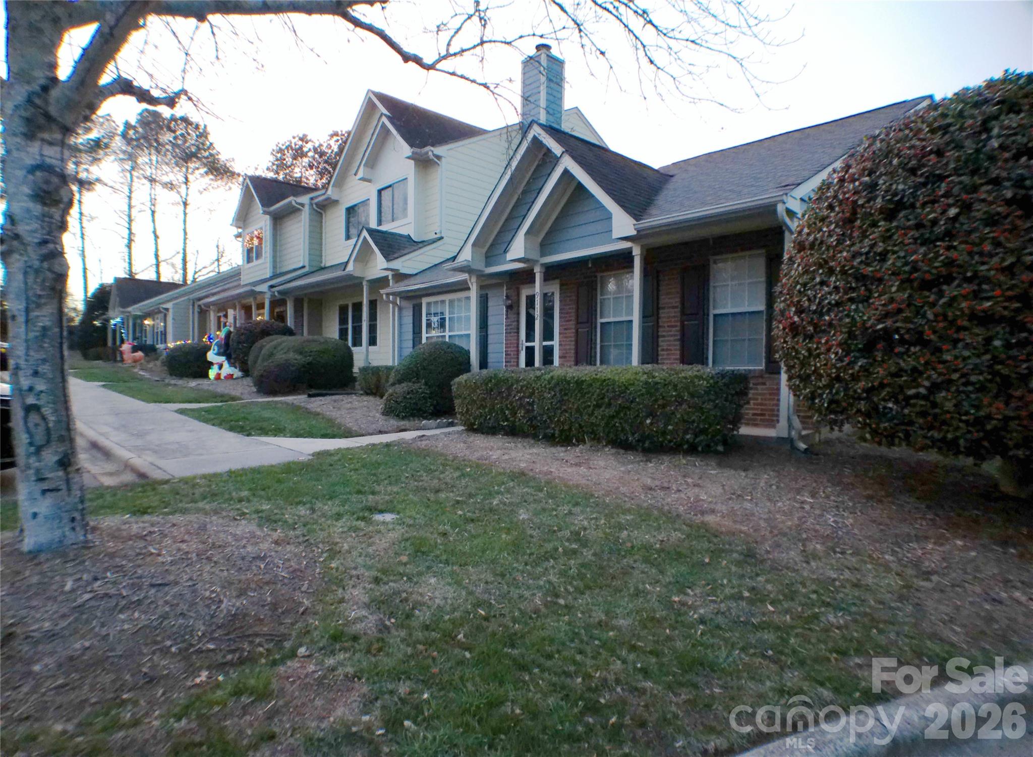 9112 4 Mile Creek Road Charlotte, NC 28277 - Photo 21 of 22 a front view of a house with a yard and trees
