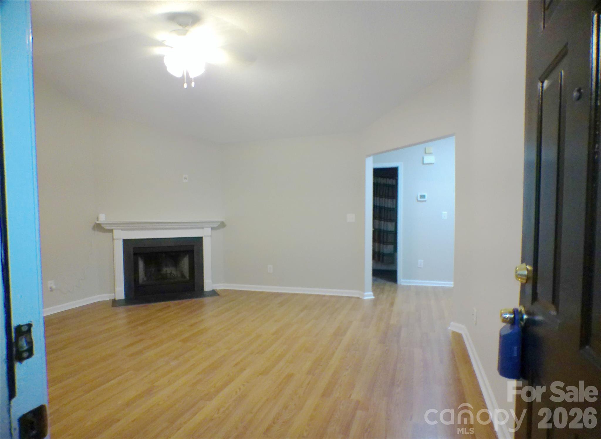 9112 4 Mile Creek Road Charlotte, NC 28277 - Photo 5 of 22 a view of an empty room with wooden floor and a window