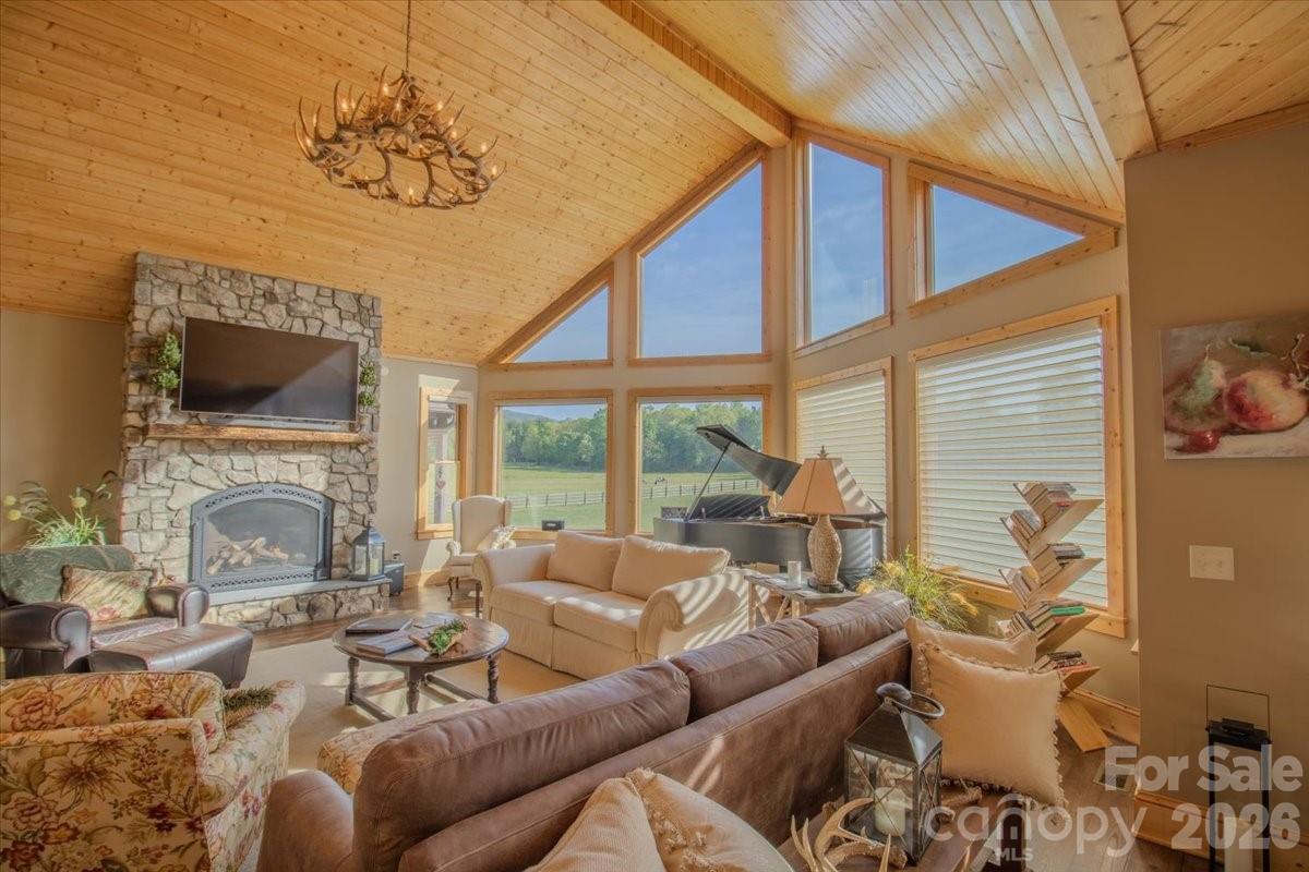 1083 Union Community Road Thurmond, NC 28683 - Photo 10 of 47 a living room with furniture a fireplace and a flat screen tv