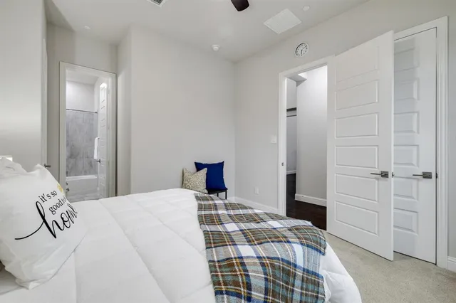 a bedroom with a bed and a walk in closet