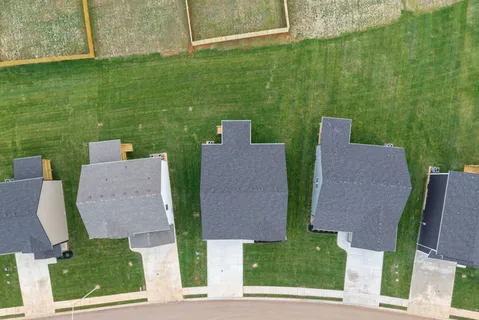 an aerial view of a house with a garden