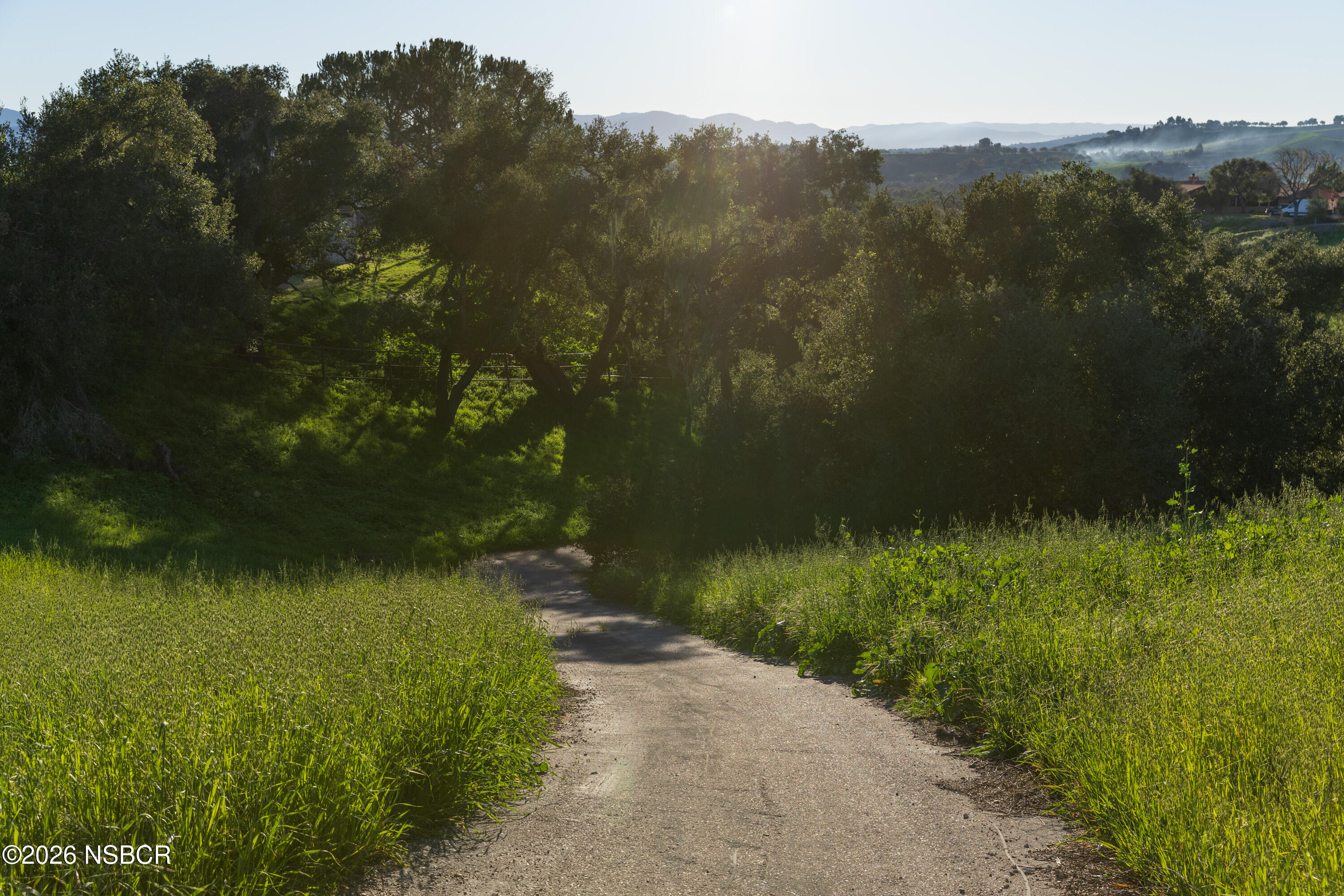 2865 North Refugio Road Santa Ynez, CA 93460 - Photo 26 of 37 a view of a lake with a yard