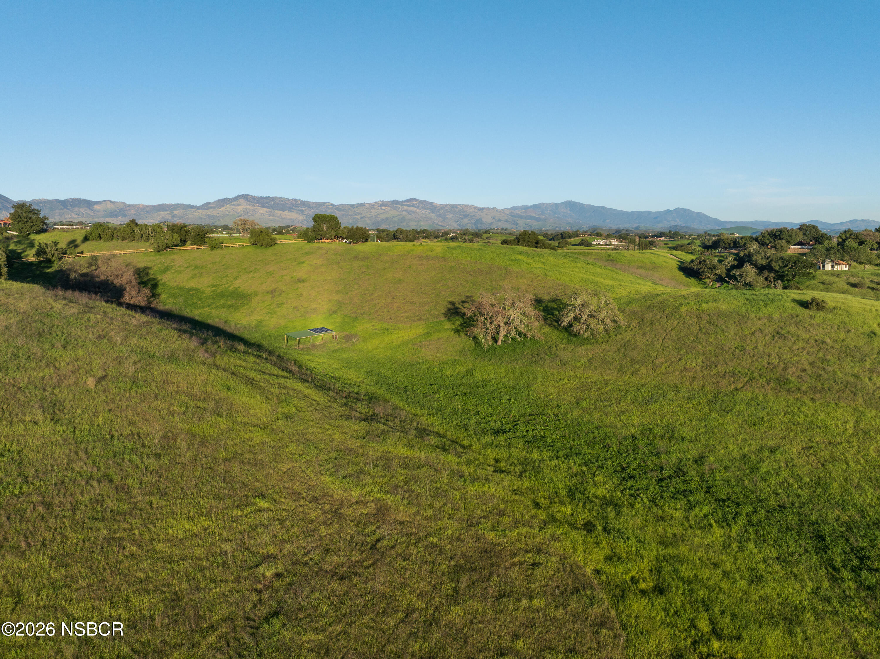 2865 North Refugio Road Santa Ynez, CA 93460 - Photo 35 of 37 a view of a lake with houses in the background