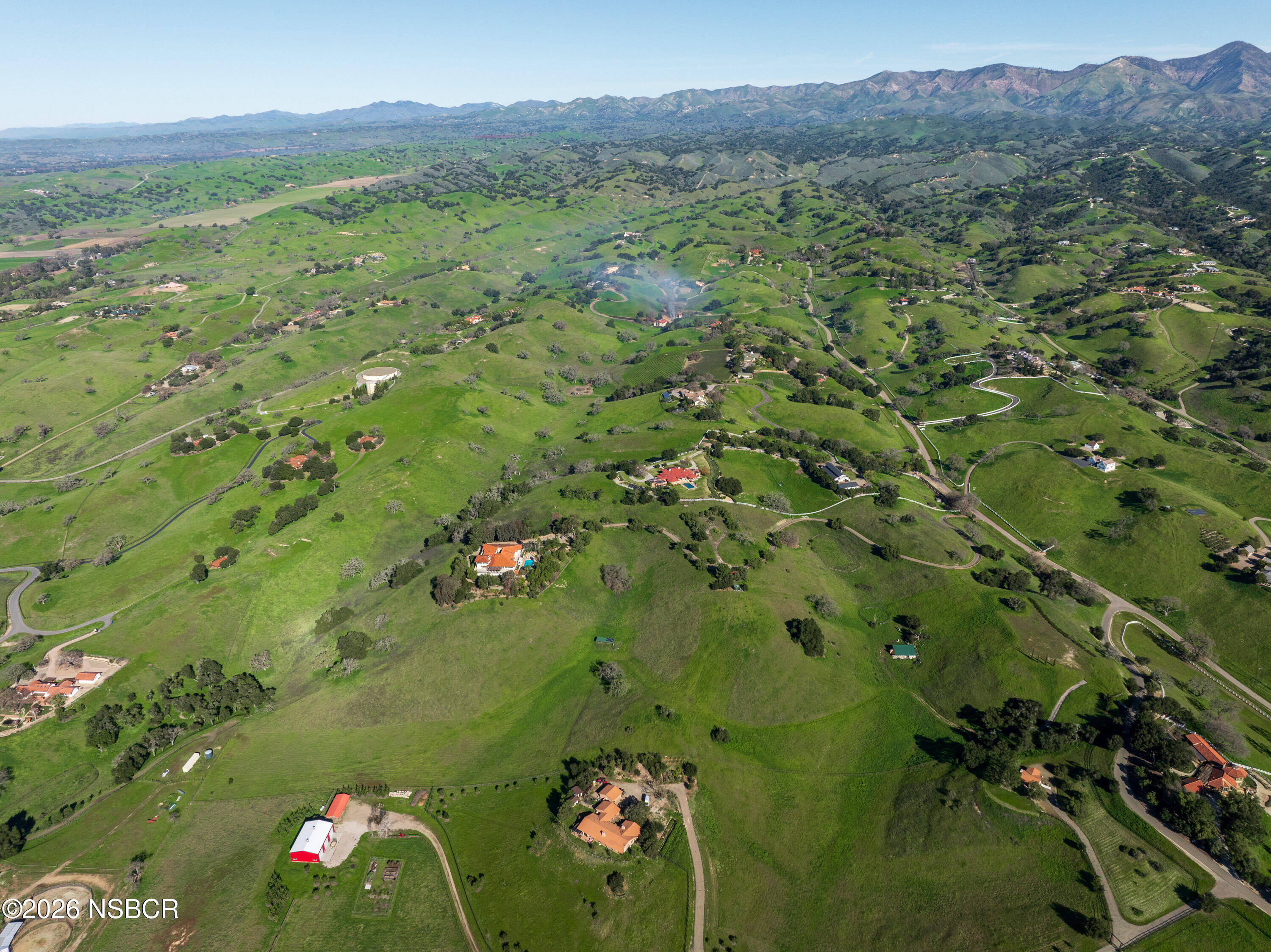2865 North Refugio Road Santa Ynez, CA 93460 - Photo 8 of 37 a view of a lush green forest with a lake