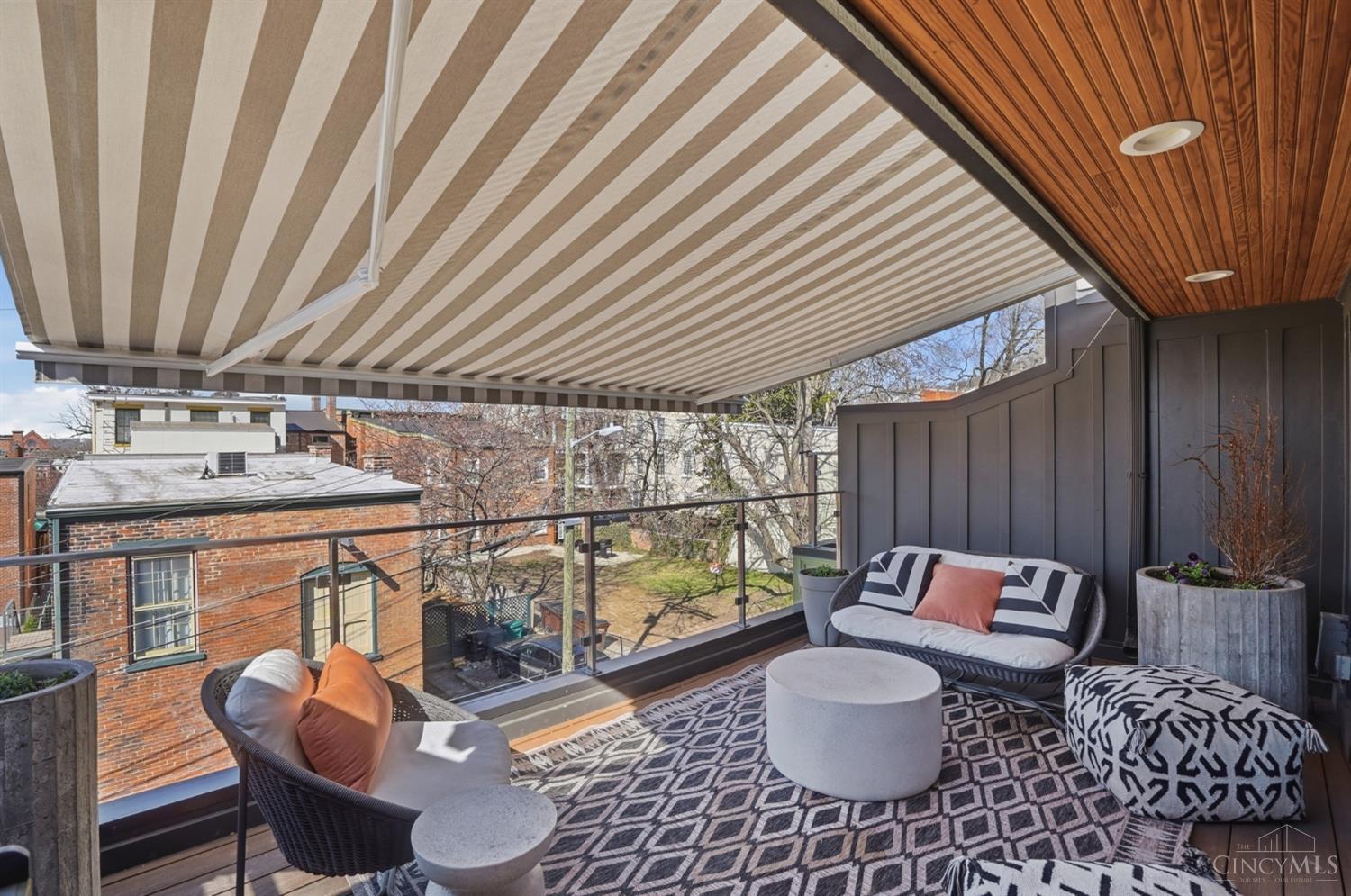 1338 Spring Street Cincinnati, OH 45202 - Photo 36 of 46 The owners installed a retractable awning with lights to the rooftop deck.