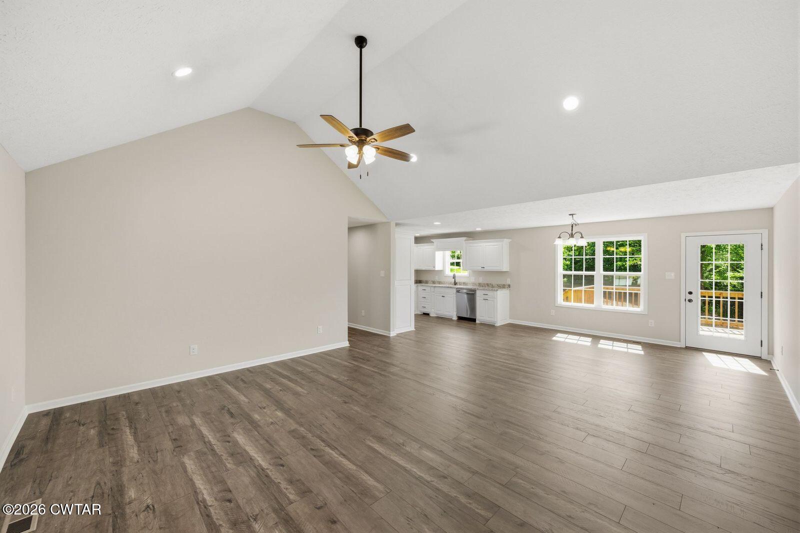 435 Old Huntingdon Road Lexington, TN 38351 - Photo 5 of 26 a view of an empty room with wooden floor and a window