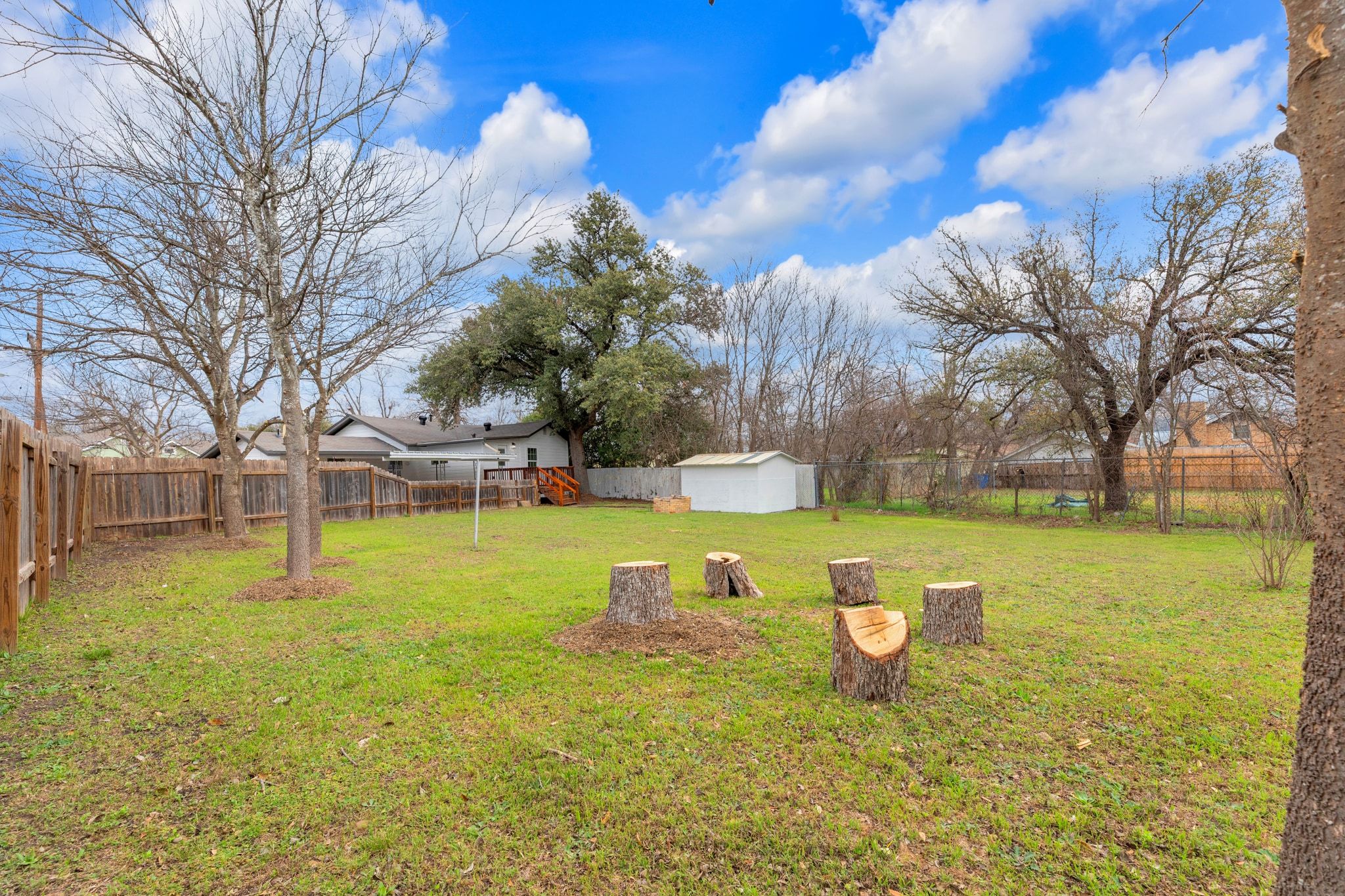 1709 Cecelia Street Taylor, TX 76574 - Photo 32 of 37 Fenced backyard with a storage unit