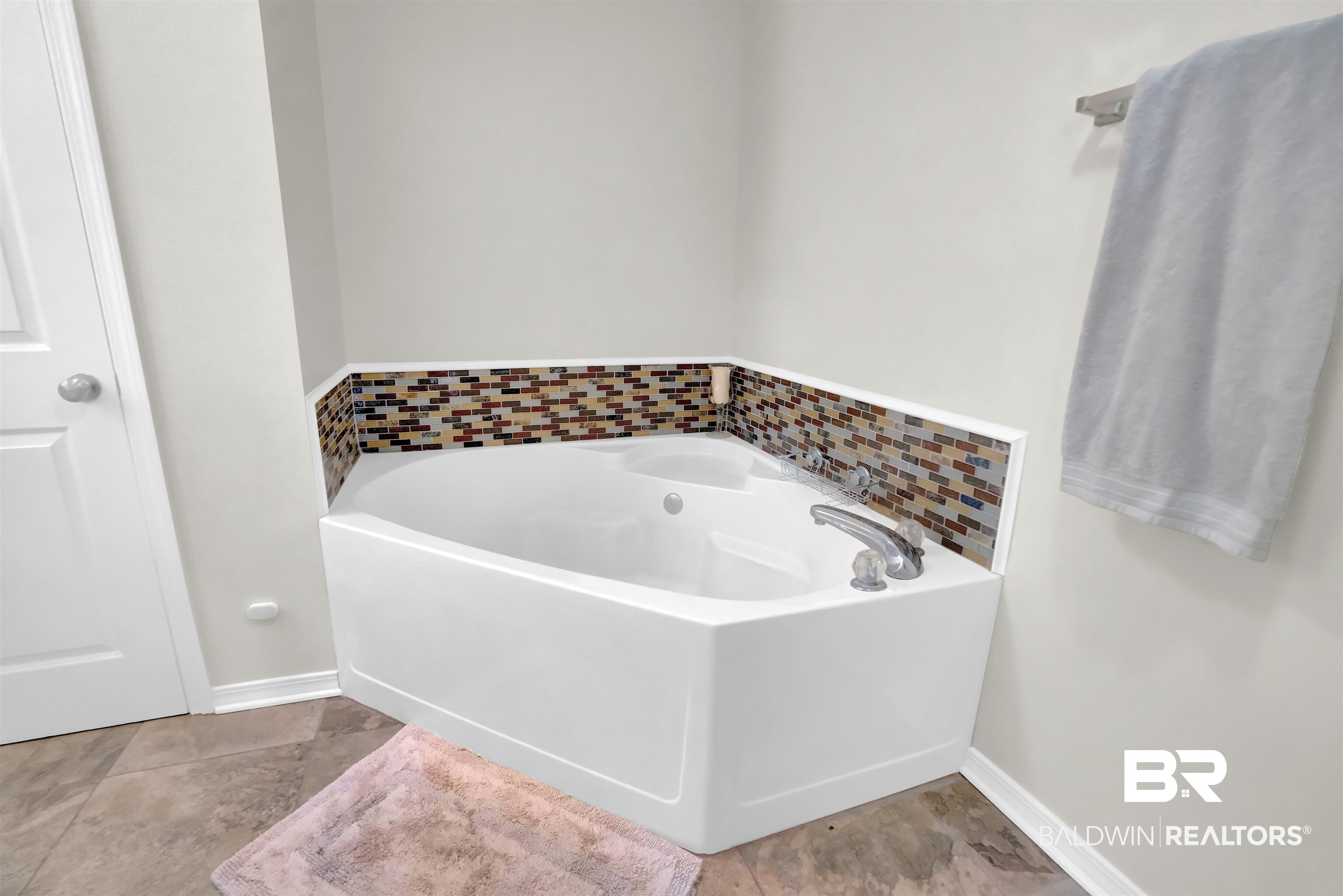 30871 Stanton Road Spanish Fort, AL 36527 - Photo 30 of 35 Bathroom featuring a bathing tub and tile patterned floors