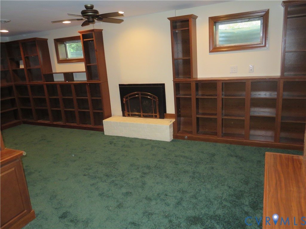 8379 Quailfield Road Mechanicsville, VA 23116 - Photo 52 of 56 a living room with a furniture and a fireplace