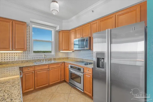 a kitchen with a sink stainless steel appliances and cabinets