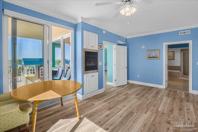a view of a livingroom with furniture window and wooden floor