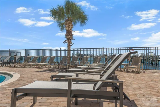a view of balcony and deck with seating space